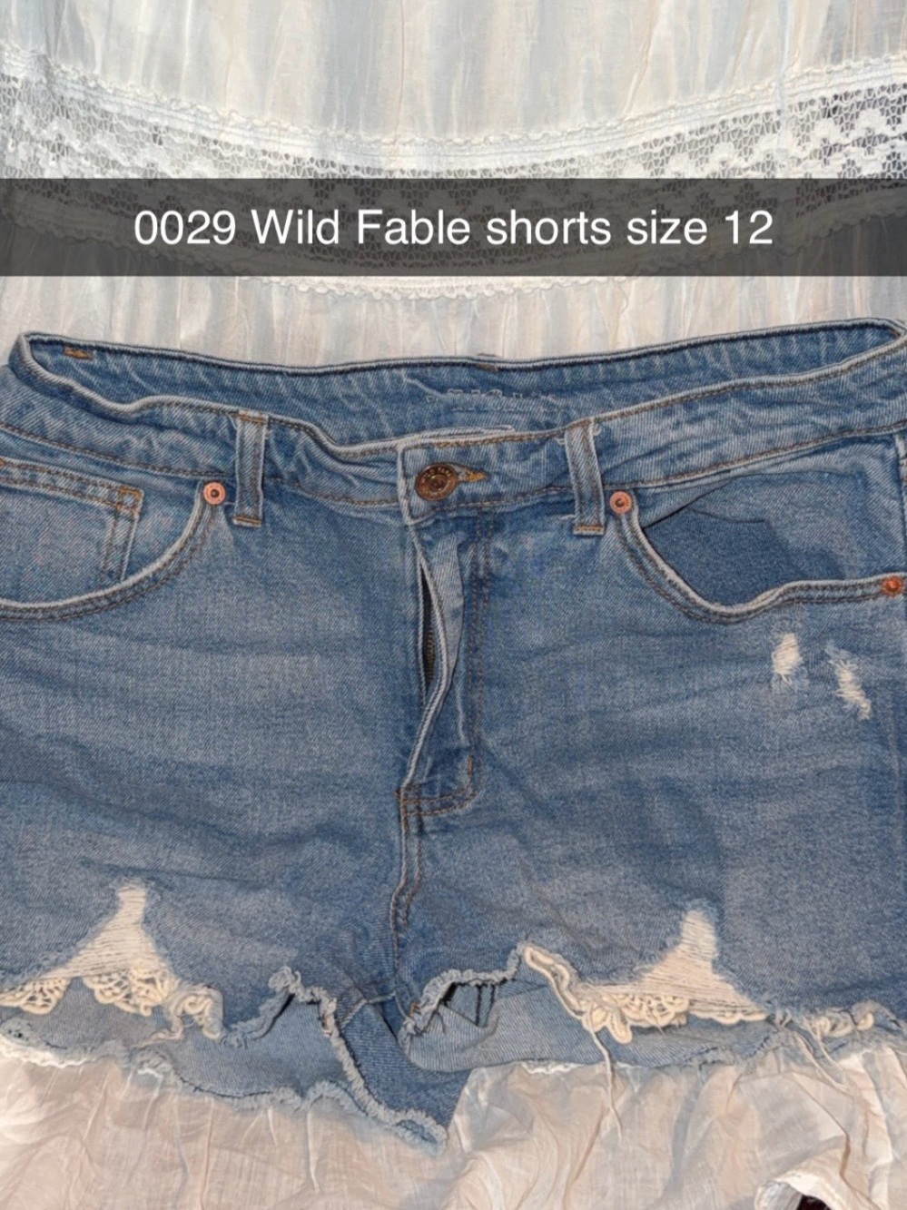 wild fable light blue distressed denim shorts with lace trim